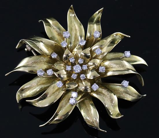A gold and diamond chrysanthemum brooch by Garrard, set with 22 brilliants (tests as 18ct), cased, gross 47 grams.